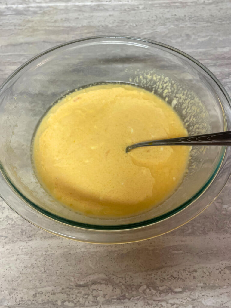 glass bowl of wet batter ingredients