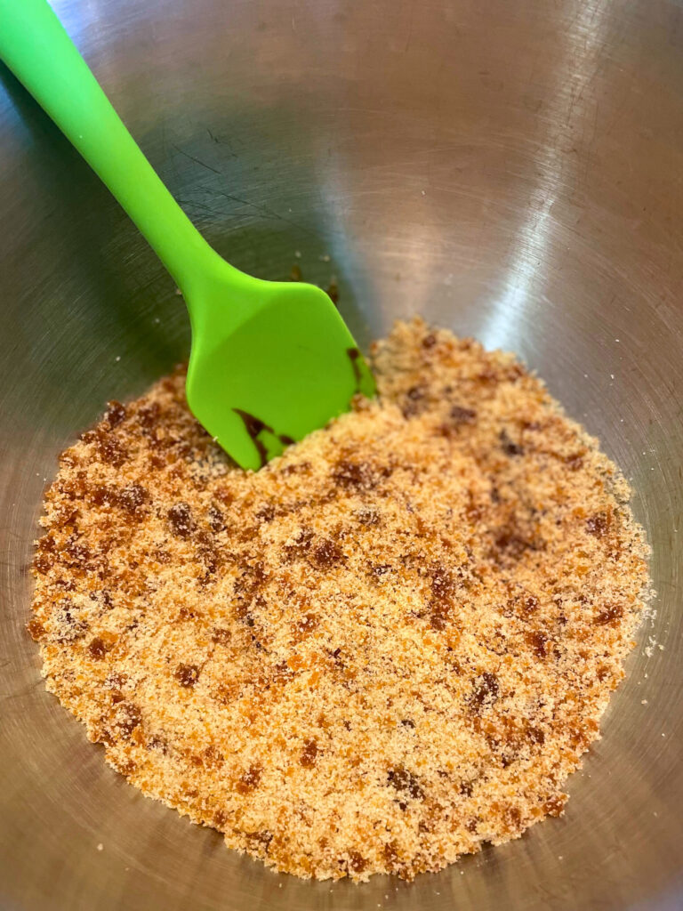 molasses and sugar being mixed in bowl