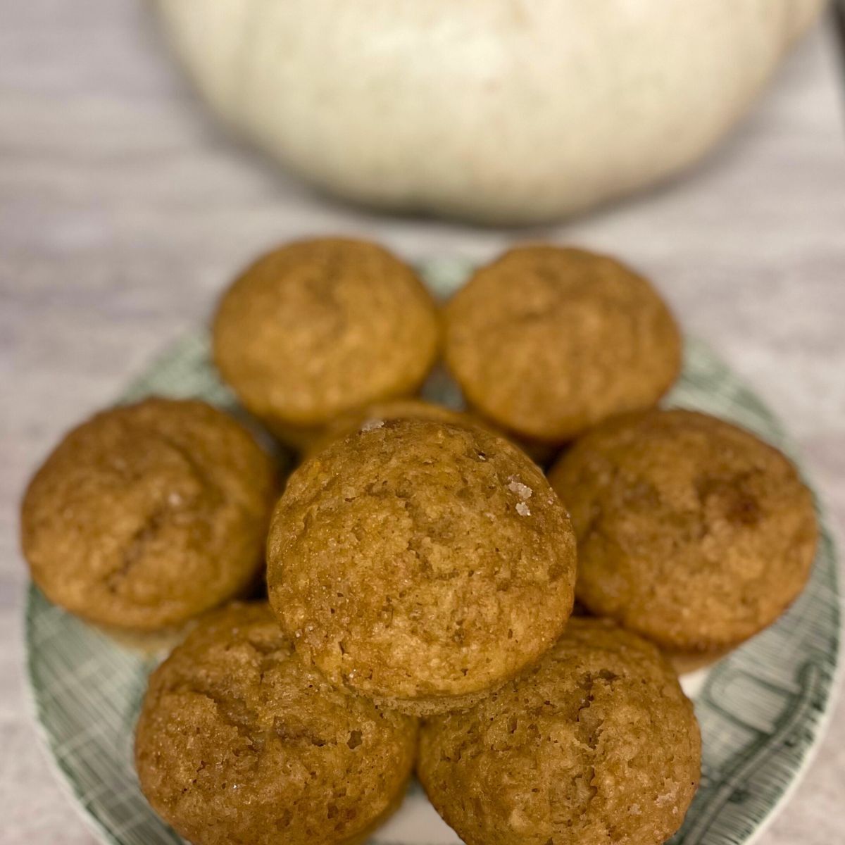 stack of pumpkin muffins on a plate
