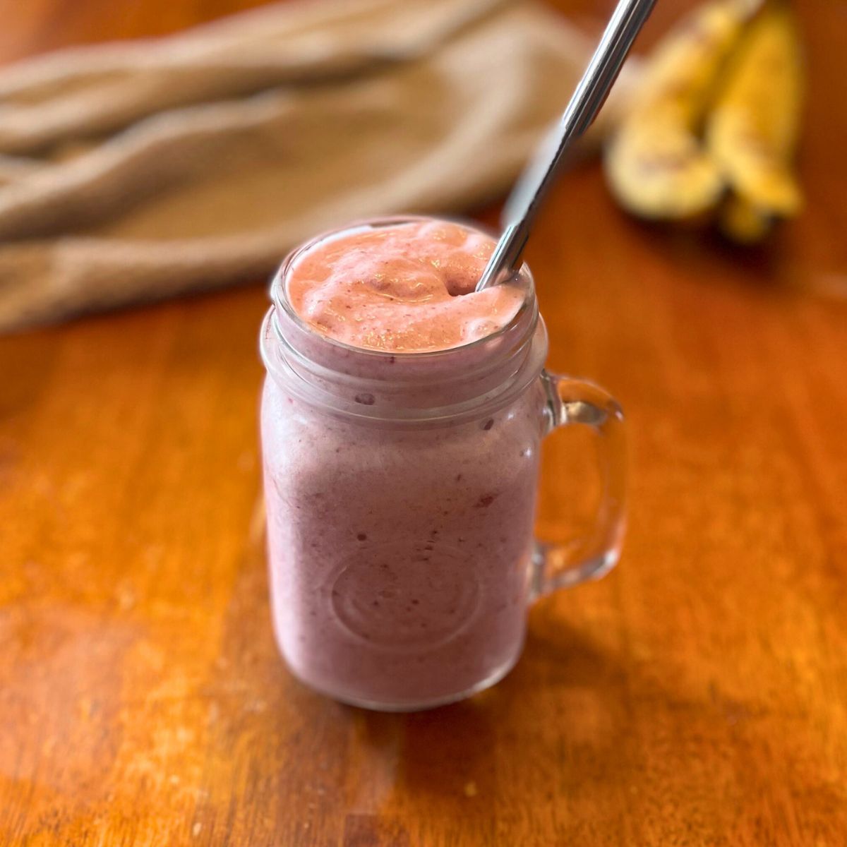 pink smoothie in glass drinking jar