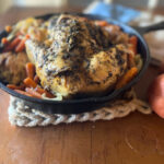 whole chicken in a cast iron skillet