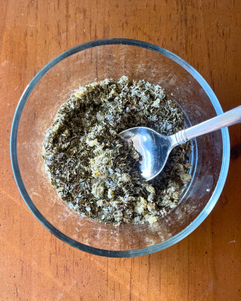 herbs mixed in a glass bowl