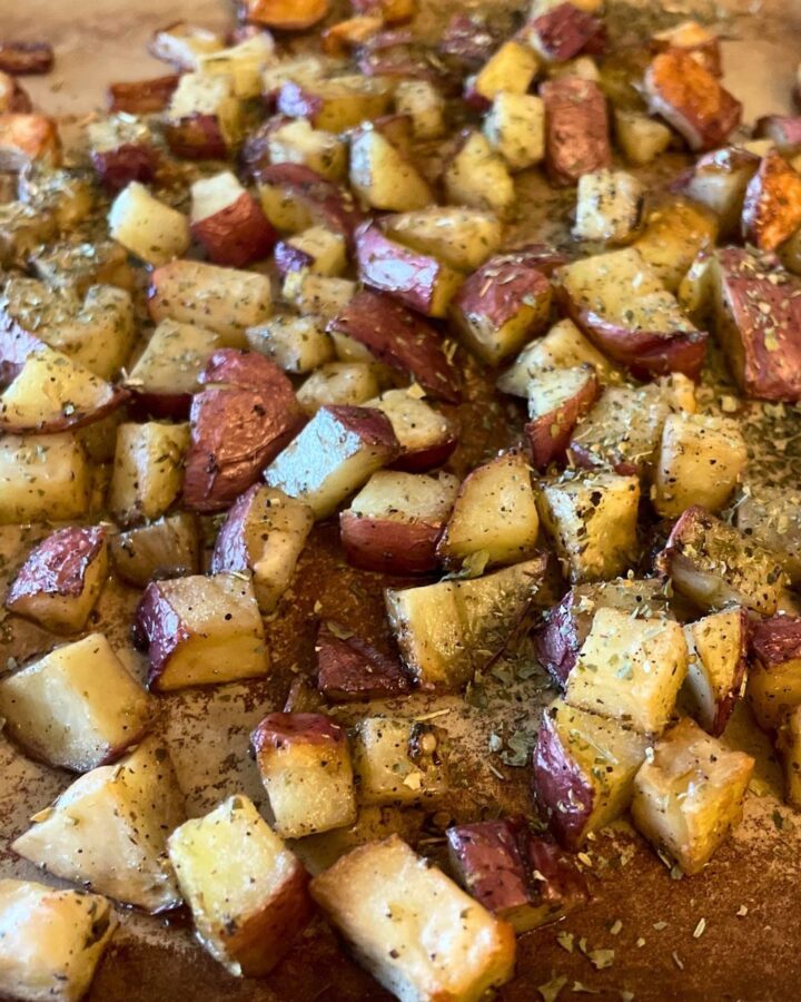cut and roasted potatoes on baking stone